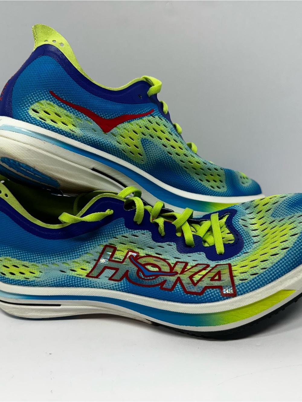 Hoka Men’s Blue and Lime Athletic Running / Track Shoes with Red Accent